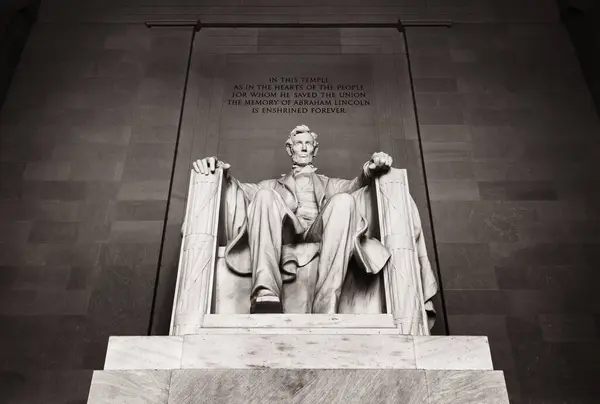 stock image Washington DC, USA - Oct. 10, 2022: The Lincoln Memorial, a solemn tribute to the 16th President of the US. A colossal marble statue of  Lincoln sits in a grand hall, surrounded by towering columns.