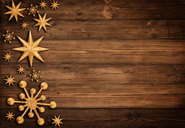 Weihnachten Holz Hintergrund Mit Goldenen Sternen Und Schneeflocken Xmas Ornament lizenzfreie Stockbilder