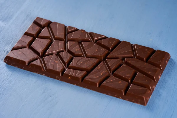 Milk Chocolate Hazelnuts Peanuts Crushed Blue Wooden Board — Stockfoto