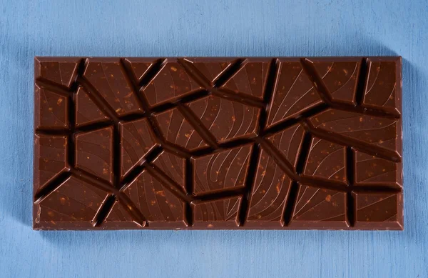 Milk Chocolate Hazelnuts Peanuts Crushed Blue Wooden Board — Stockfoto