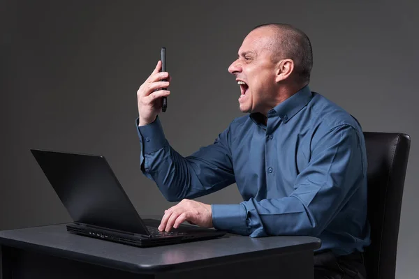 Very Angry Demanding Mature Businessman Yelling Phone Conference While Being Obrazek Stockowy