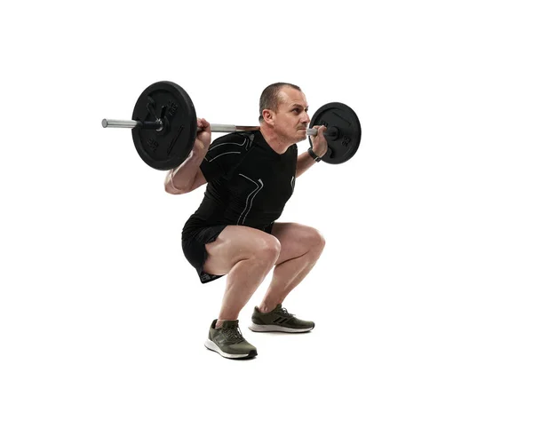 Sportovní Muž Středního Věku Dělá Dřepy Fitness Cvičení Činkou Izolované — Stock fotografie