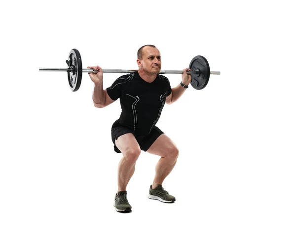 Lekkoatletyczny Mężczyzna Średnim Wieku Robi Przysiady Fitness Trening Sztangą Izolowany — Zdjęcie stockowe