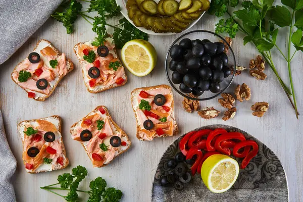 Smoked Salmon Herbs Olives Bruschetta Bread Mediterranean Appetizer Wooden Board — Stock Photo, Image