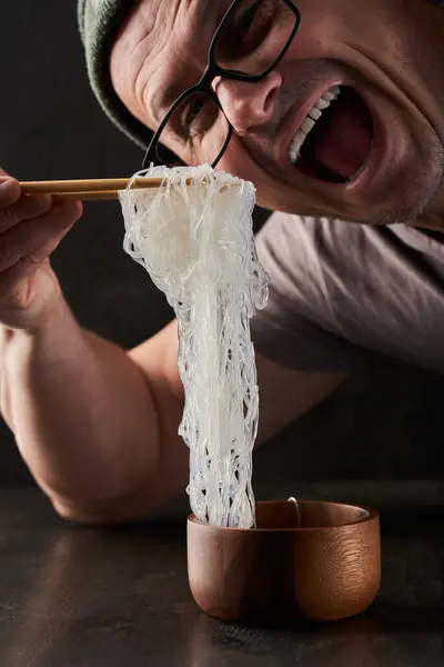 Man Ready Eat Large Portion Glass Noodles Asian Speciality Wooden — Stock Photo, Image