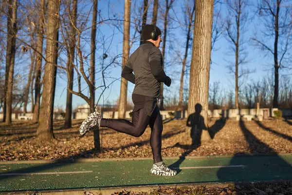 Mature Athlete Running Park Cold Sunny Winter Day — Stock Photo, Image