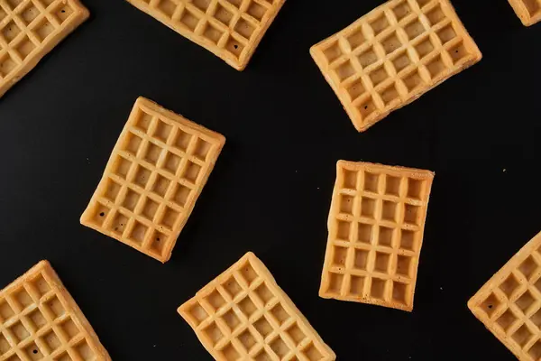 Pile Belgian Waffles Closeup Black Background 로열티 프리 스톡 이미지