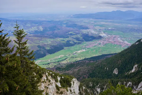 Aerial landscape with mountains and a town in the distance