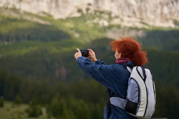 Woman Hiker Backpack Shooting Photos Her Mobile Phone Mountains Beautiful Стоковое Изображение