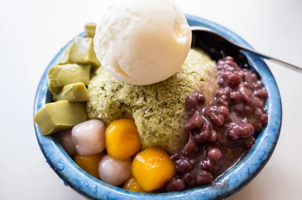eating shaved ice with colorful dessert, famous Taiwanese snacks at Taiwan
