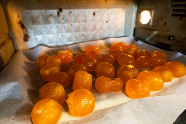 Salted egg yolks are being prepared in the oven, getting ready for the next step of baking.