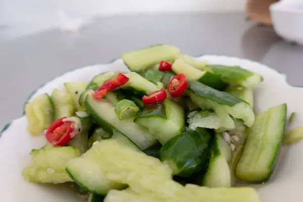 taiwanese snacks of  pickled cucumbers on a plate in a restaurant