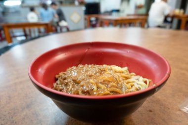 Bowl of sesame paste noodles clipart