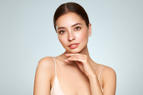 Portrait beautiful young woman with clean fresh skin. Model with healthy skin, close up portrait. Cosmetology, beauty and spa