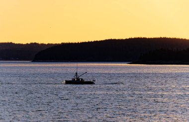 Fishing Boat Near Sunrise