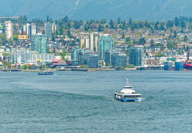 VANCOUVER, BRITISH COLUMBIA - 3 Mayıs 2023: Vancouver, Britanya Kolumbiyası 'nın hareketli bir batı kıyısı limanı, Kanada' nın en yoğun ve etnik çeşitliliğe sahip şehirleri arasındadır..