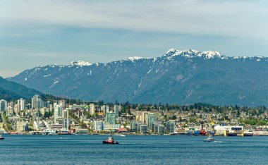 VANCOUVER, BRITISH COLUMBIA - 3 Mayıs 2023: Vancouver, Britanya Kolumbiyası 'nın hareketli bir batı kıyısı limanı, Kanada' nın en yoğun ve etnik çeşitliliğe sahip şehirleri arasındadır..
