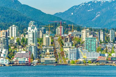 VANCOUVER, BRITISH COLUMBIA - 3 Mayıs 2023: Vancouver, Britanya Kolumbiyası 'nın hareketli bir batı kıyısı limanı, Kanada' nın en yoğun ve etnik çeşitliliğe sahip şehirleri arasındadır..