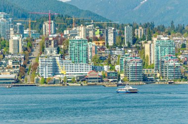 VANCOUVER, BRITISH COLUMBIA - 3 Mayıs 2023: Vancouver, Britanya Kolumbiyası 'nın hareketli bir batı kıyısı limanı, Kanada' nın en yoğun ve etnik çeşitliliğe sahip şehirleri arasındadır..