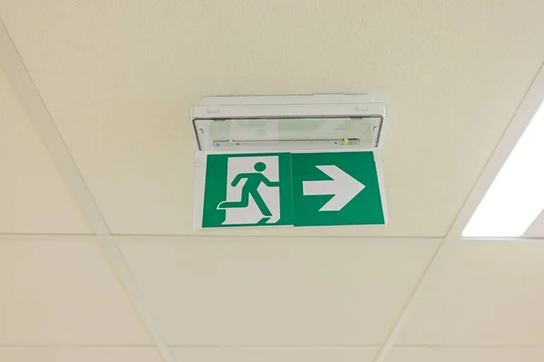 Emergency Exit Direction Arrow Sign at Ceiling