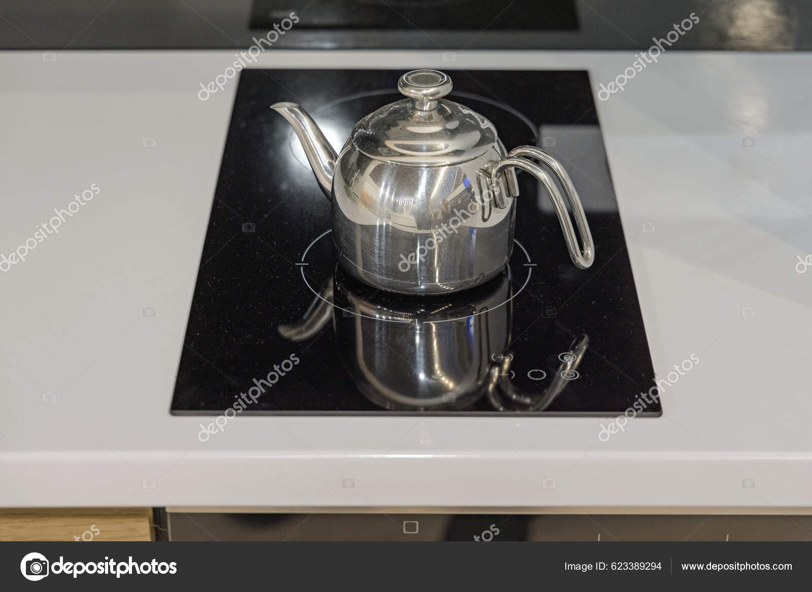 https://st5.depositphotos.com/1005951/62338/i/1600/depositphotos_623389294-stock-photo-stainless-steel-tea-kettle-induction.jpg