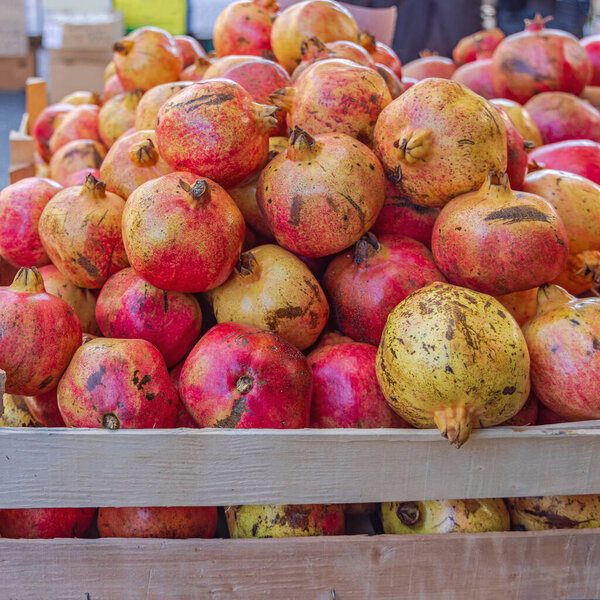 Fresh Pomegranate Fruits Produce at Farmers Market Stall
