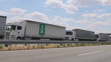 Horgos Roszke, Hungary - August 01, 2022: Long Queue of Trucks Shipping Cargo Stuck at EU Border Logistics Problems.