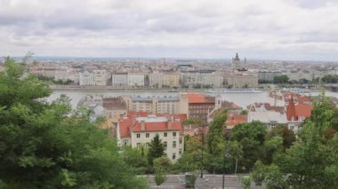 Budapest, Hungary - July 31, 2022: Danube River Cityscape Cloudy Summer Day Panorama.