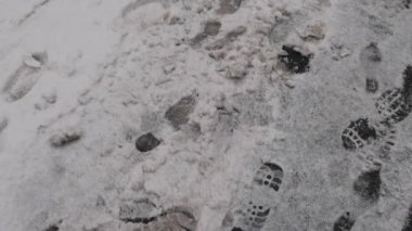 Foot Prints at Pedestrian Street Covered With Snow Cold Winter Day