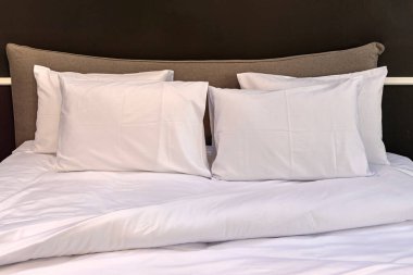 Four Large Pillows White Cotton Bedding at Big Bed