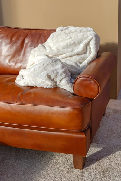 White Blanket Throw at Leather Couch Sofa Living Room