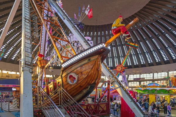 Belgrade, Serbia - December 25, 2022: Pirate Ship Pendulum Ride Amusement Park in Large Exhibition Hall Winter Fun Fair.