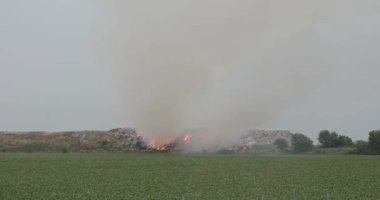 Firefighters at Landfill Dump Site Fire Smoke Air Pollution Trash Problems