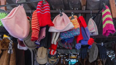 Many Colourful Wool Winter Beanie Hats Ski Caps Hanging