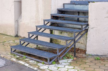 Metal External Stairs Structure With Carpet at White Building