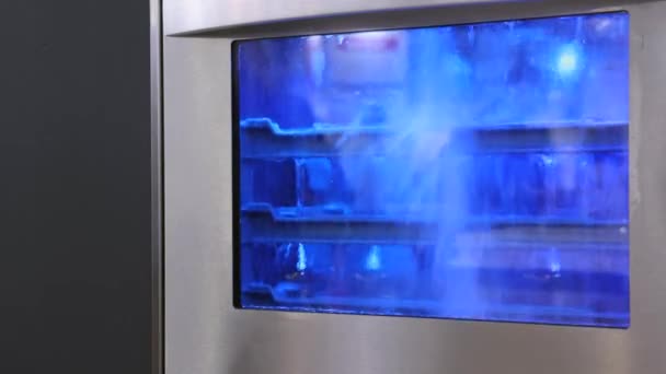 Splashing Water Glass Washing Machine Blue Lights Cleaning Process — Vídeos de Stock