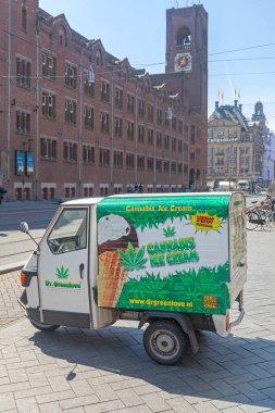 Amsterdam, Netherlands - May 14, 2018: Cannabis Ice Cream Dr Green Love Delivery Vehicle at Street in Amsterdam, Holland. clipart