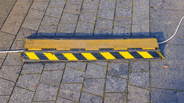 Outdoor Cable Protector Safety Device Cover at Tiled Pavement