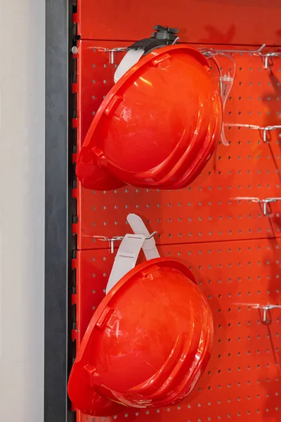 Two Red Plastic Hard Hats Wall Shelf Rack Personal Protective — Stock Photo, Image