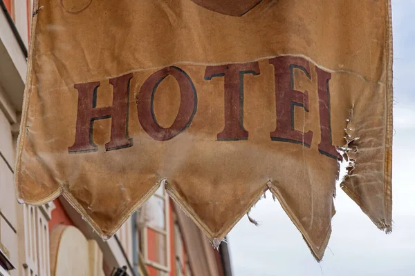 Tattered Torn Old Hotel Flag Medieval Style Sign Poor Condition — Stock Photo, Image