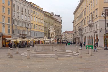 Trieste, Italy - January 12, 2017: Fountain of Neptune Landmark at Borsa Square Cold Winter Day in City.
