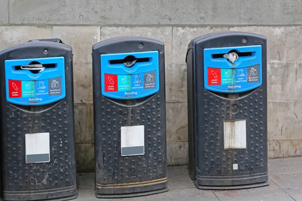 Three Plastic Recycle Bins for Trash at Street in London