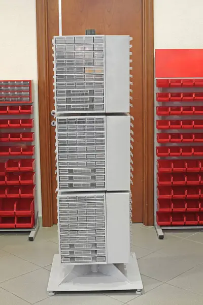 Small Transparent Drawers for Parts in Tower Rack Workshop Organization