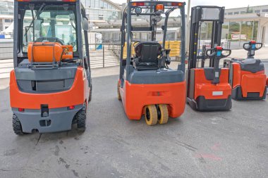 Four Forklift Trucks Gas and Electric Powered Vehicles clipart