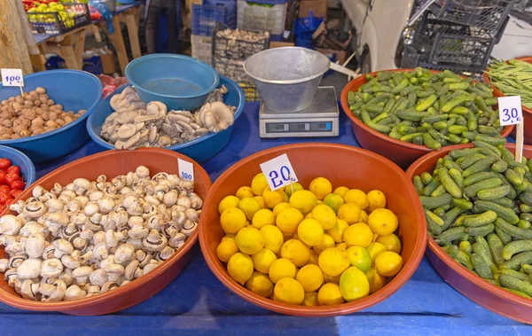 Lemons Mushrooms Cucumbers in Bowls at Farmers Market