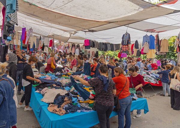 Istanbul, Turkey - October 21, 2023: Garment Clothing Textile Fashion Open Market at Top of Multistory Car Park Garage in Besiktas Only Saturday.
