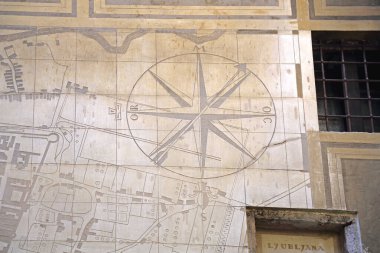 Ljubljana, Slovenia - October 12, 2014: Historic Map From XVII Century Compass at Wall in Town Hall Building Capital City. clipart