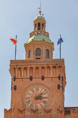 Bologna, Italy - June 16, 2019: Public Clock Tower Torre dell Orologio at Palace Accursio Historic Landmark Summer Day. clipart