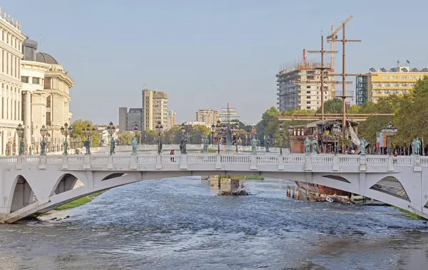 stock image Skopje, North Macedonia - October 23, 2023: Bridge of Civilisations Over River Vardar in Capital City Centre at Fall Day.