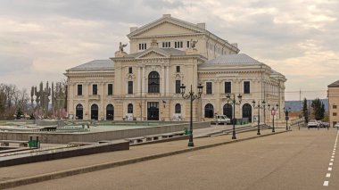 Drobeta Turnu Severin, Romania - March 15, 2024: Cultural Palace Teodor Costescu Performing Theatre at Boulevard Carol I Spring Day. clipart